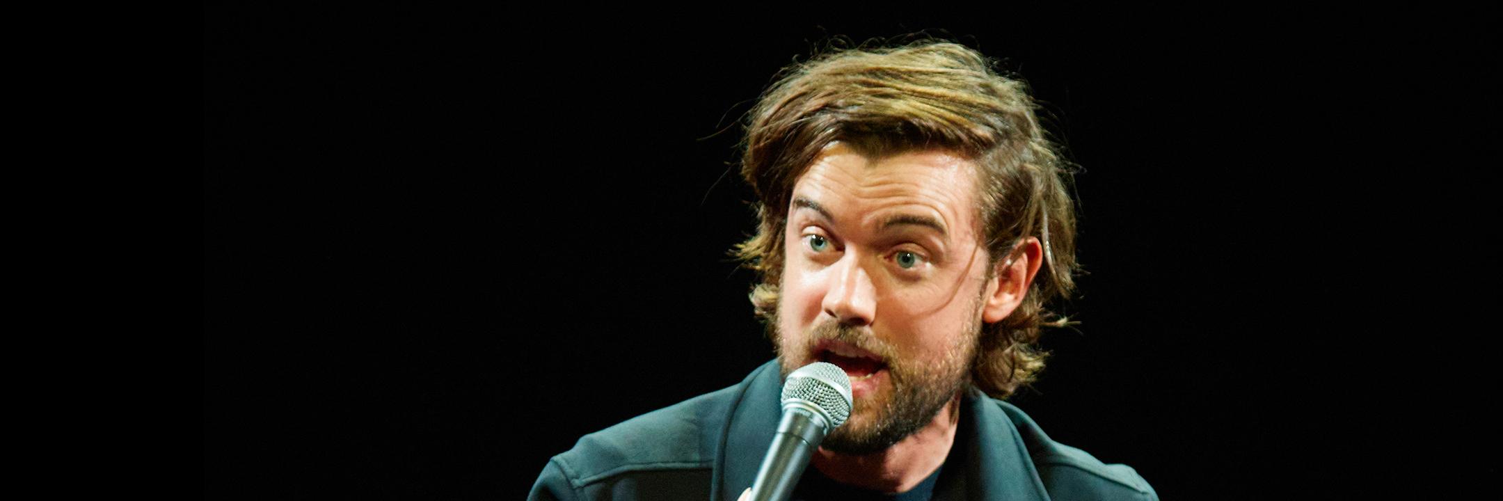 Former Comedy Reserve headliner, Jack Whitehall is mid flow delivering a stand up set on stage.