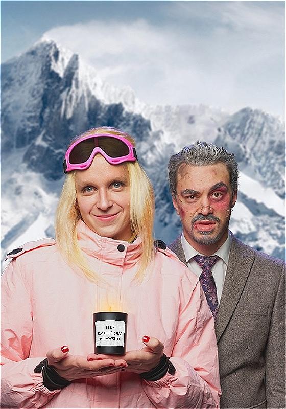 To the left Linus as Gwyneth in ski gear holding a candle that says 'smells like a lawsuit.' To the right Joseph as Terry looking dazed as if he's been in a ski accident.