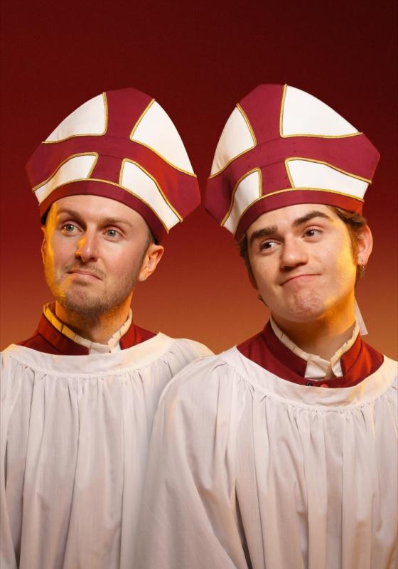 Two men in matching Bishop outfits