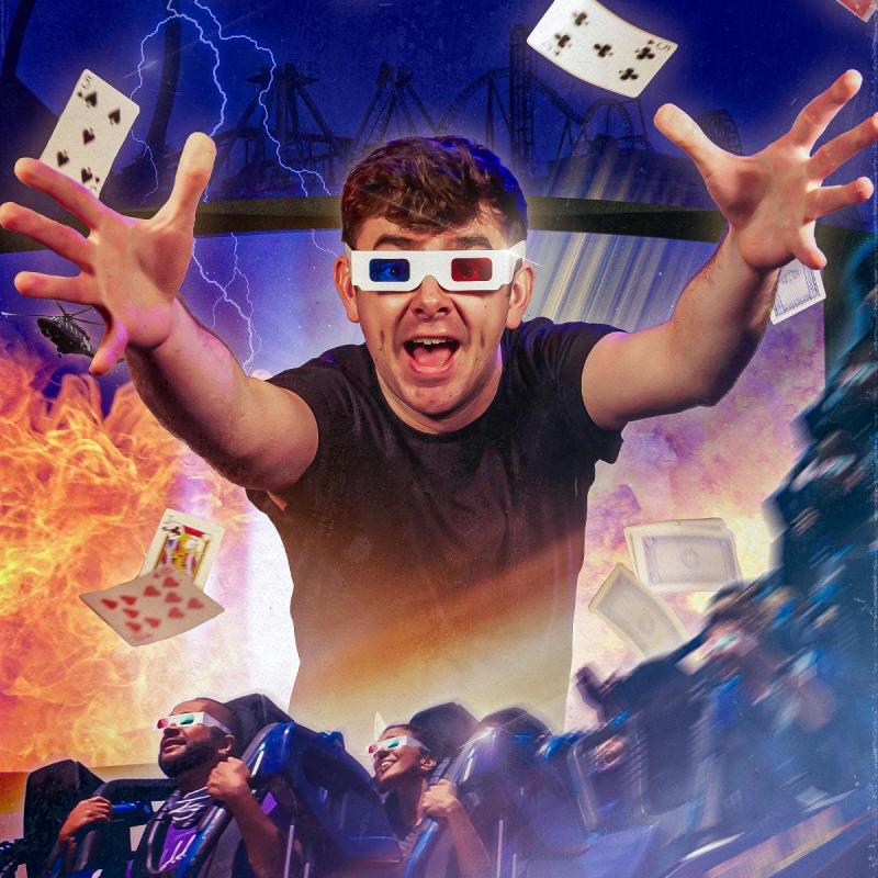 Tom Brace reaches towards the camera with a grin, wearing old-school 3D glasses. Explosions and cards flying about behind him. In the foreground a rollercoaster full of people curves round the frame of the photo.