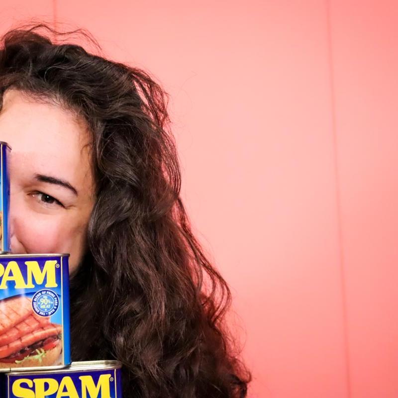 Sierra is hiding behind a pile of Spam cans