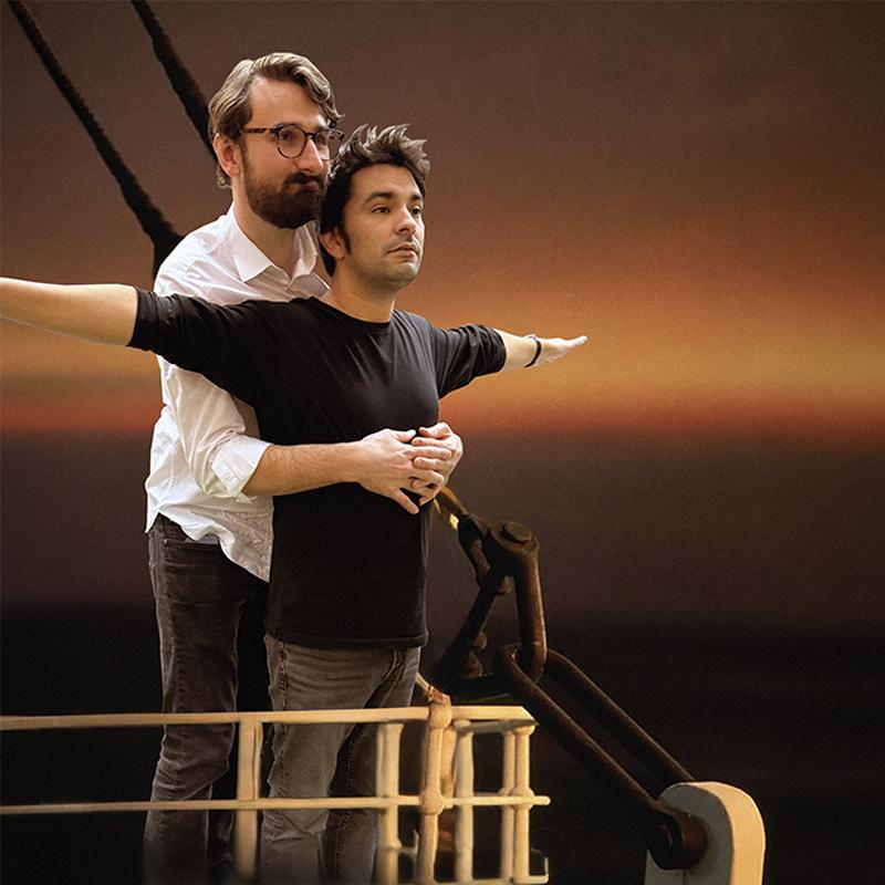 Iconic Titanic pose on the boat with arms outstretched by the host duo.