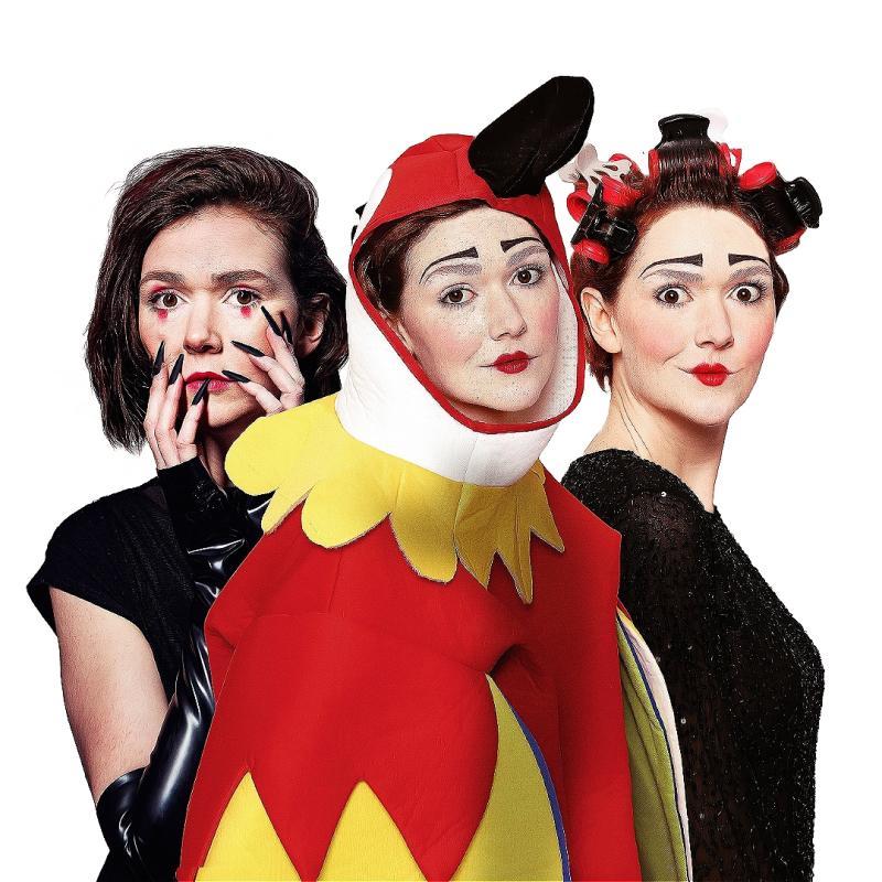 Elf Lyons (the clown) is dressed as a Raven, a Parrot and a woman in rollers. She looks inquisitively towards the camera. 